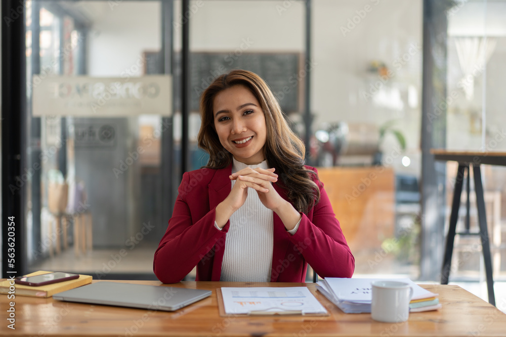 Young woman working with a laptop. Female freelancer connecting to internet via computer. Businesswo