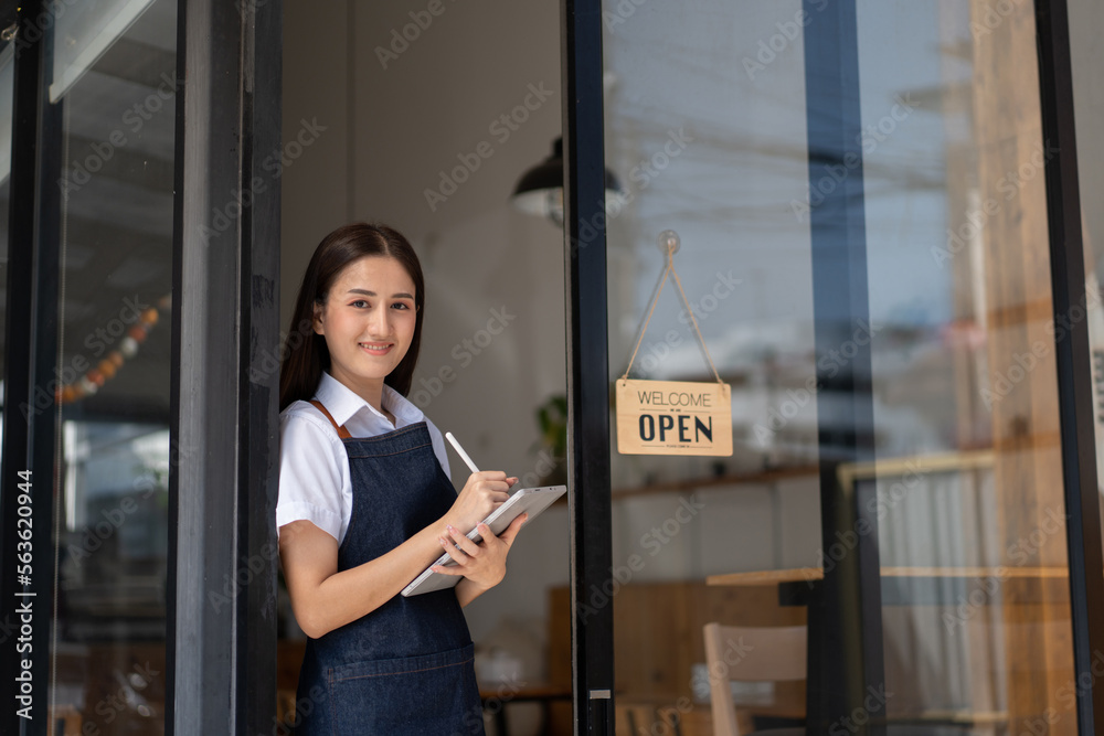 Opening a small business, Happy Asian woman in an apron standing near a bar counter coffee shop, Sma