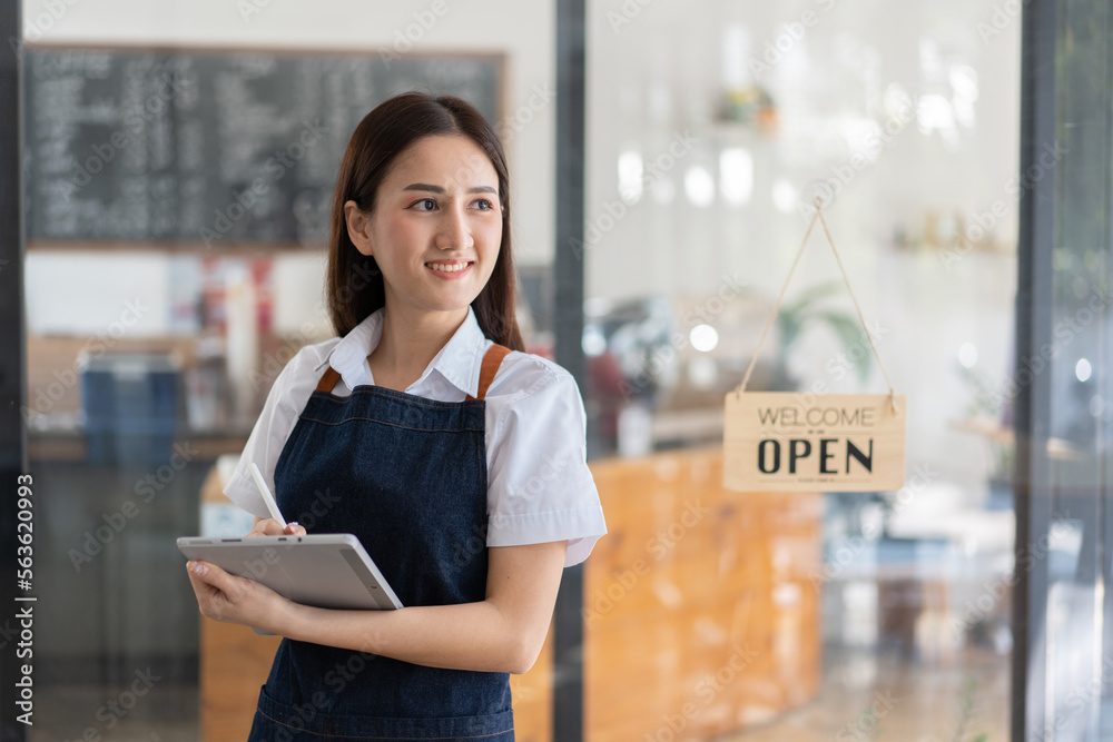 Opening a small business, Happy Asian woman in an apron standing near a bar counter coffee shop, Sma