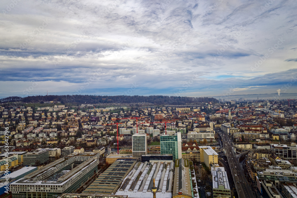 Aerial view of City of Zürich seen from industrial district with North District in the background on