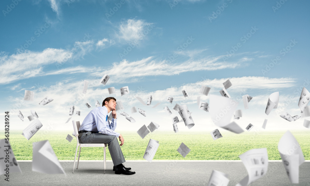 Young businessman sitting on an office chair