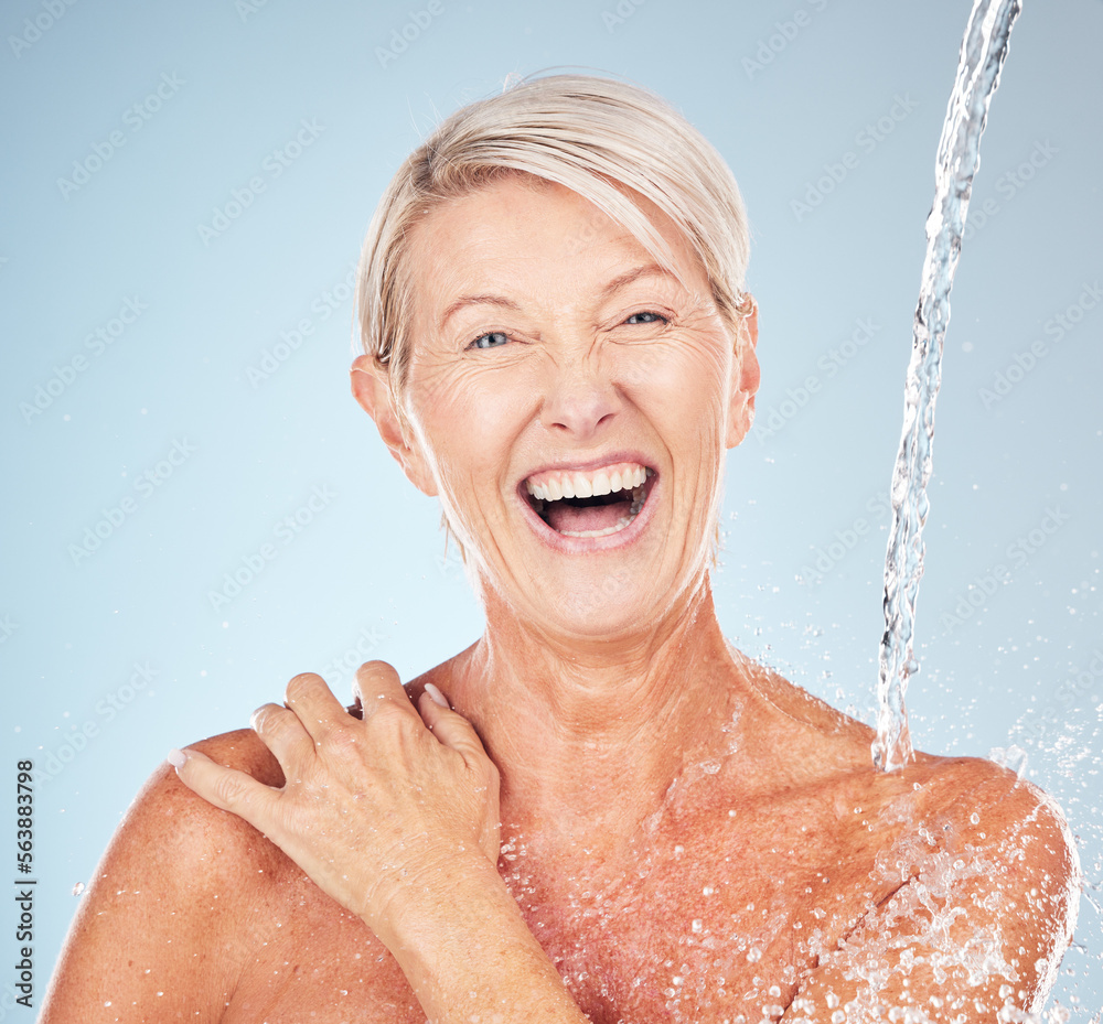 Happy, cleaning and portrait of a woman with a water splash isolated on a blue background in studio.