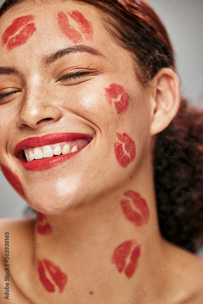 Face, red lipstick kiss and makeup on face model woman in studio for cosmetics and happiness. Headsh