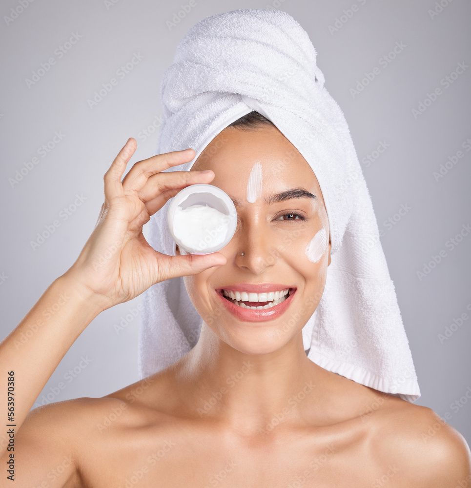 Woman, cream and skin in studio portrait for wellness, aesthetic or cosmetic health with towel by ba