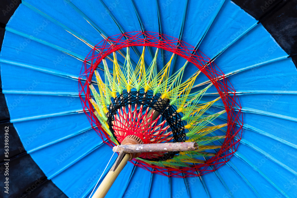 Hand made white paper umbrella with wood splines on  background, Background, hand made umbrella, pap