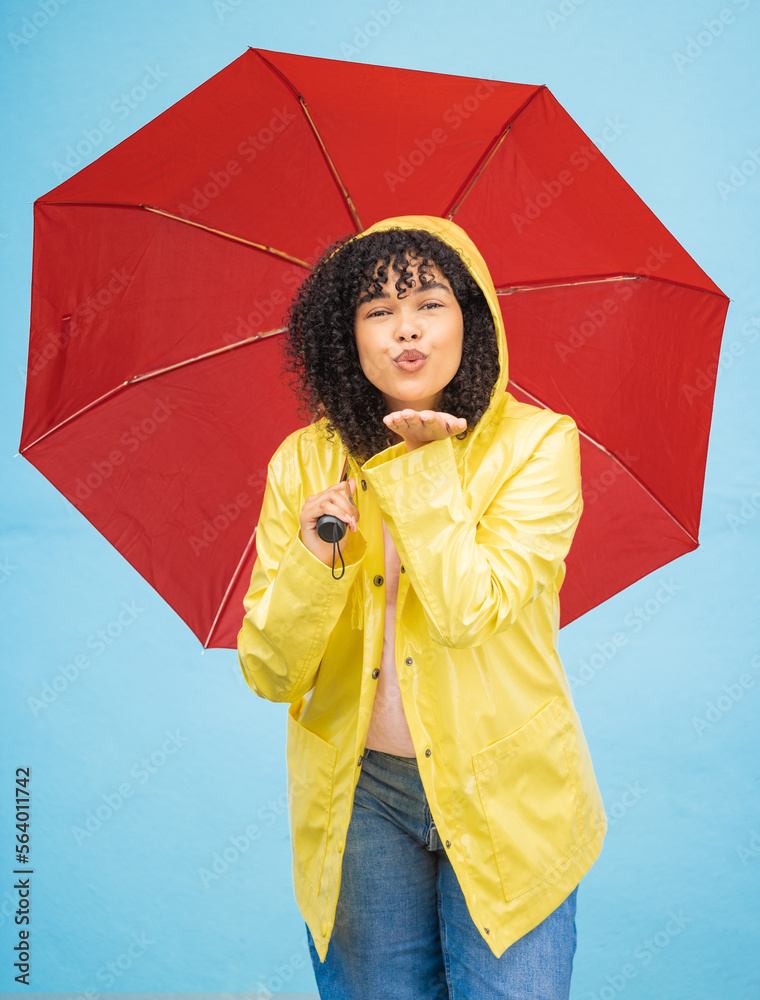 Portrait, black woman and umbrella in a city for kiss, travel and flirting on a solo trip against wa