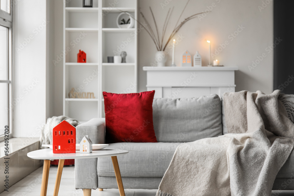 House candle holders on table in interior of living room