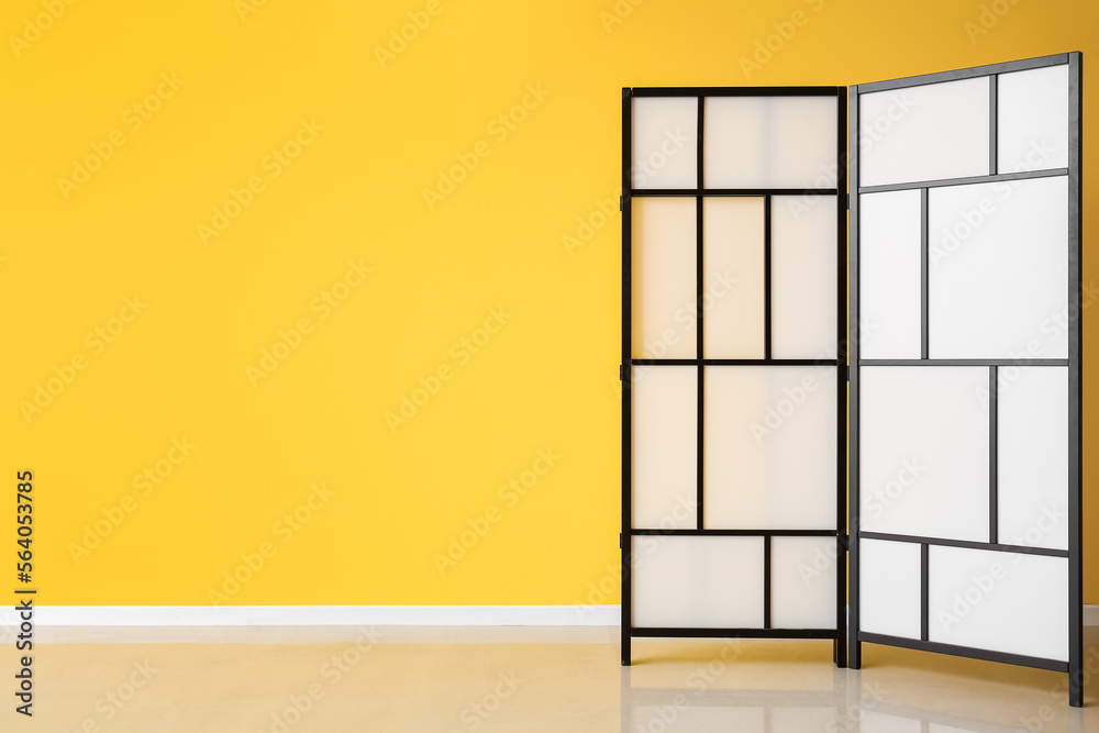 Folding screen near yellow wall