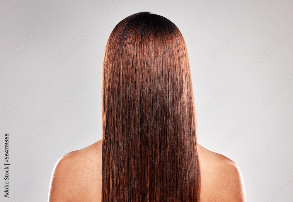 Back, woman and hair care with shine, glow and natural beauty with girl on grey studio background. H