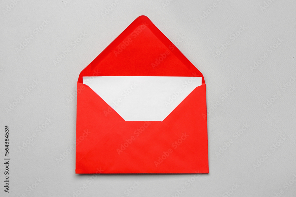 Red paper envelope with card on light background