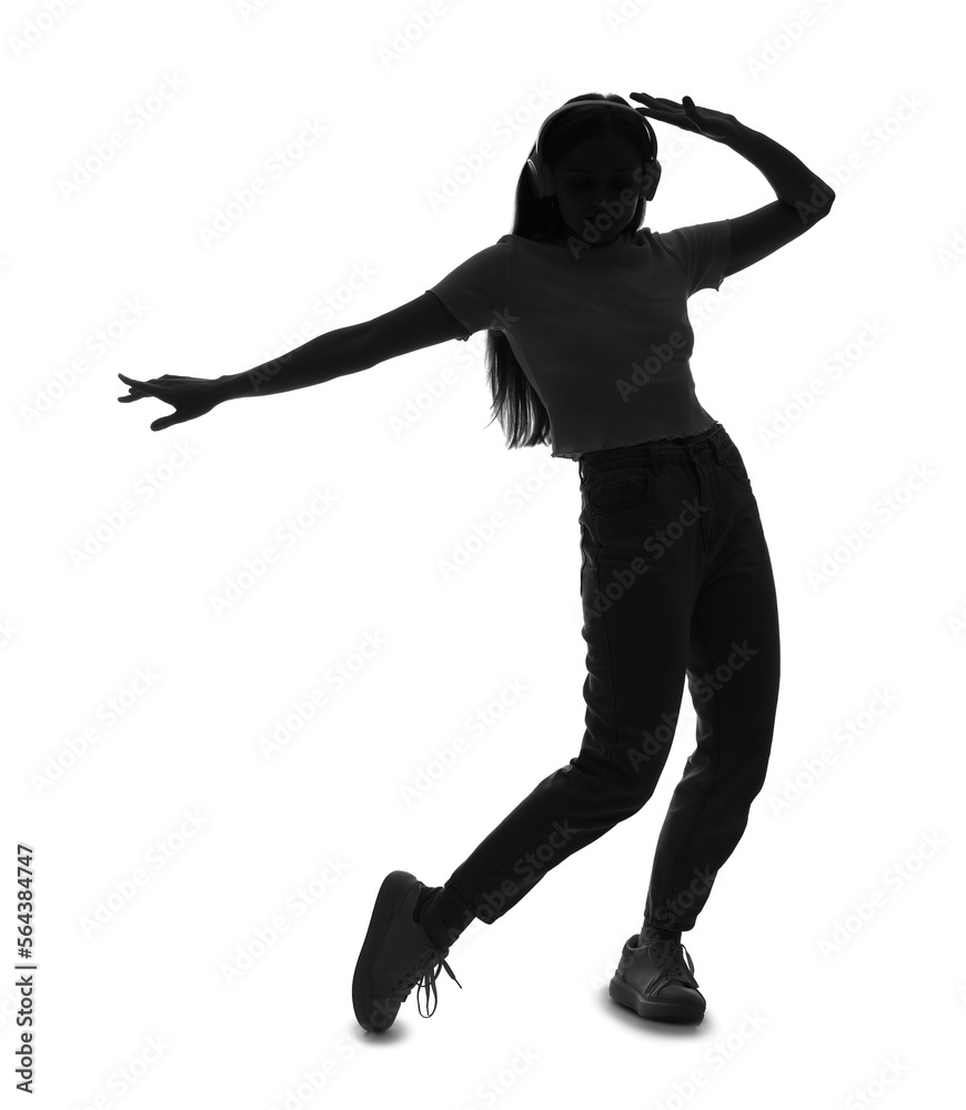 Silhouette of young woman in headphones dancing on white background