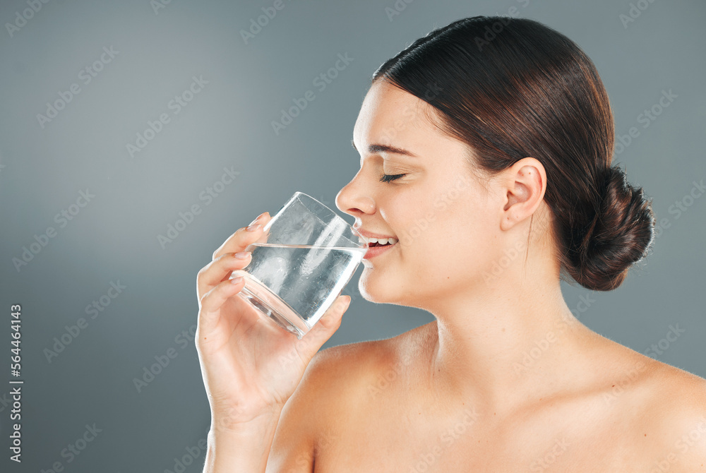 Woman, glass and drinking water for hydration, skincare or nutrition for sustainability against grey