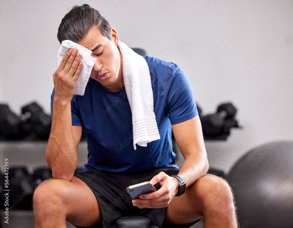 Sweat, tired and man resting in the gym after a intense workout, exercise sports training. Fitness, 