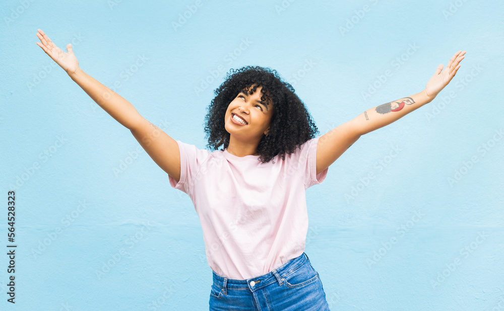 African woman, smile and open arms in studio for mockup, happiness celebration and excited in blue b