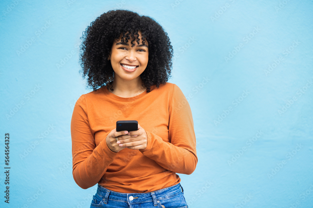 Happy black woman, fashion or phone typing on isolated blue background on Brazil city app, social me