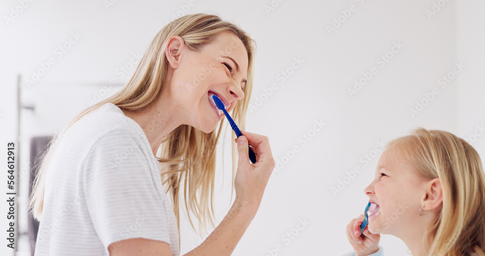 Toothbrush, mother and girl cleaning their teeth in the morning in the bathroom of their family home