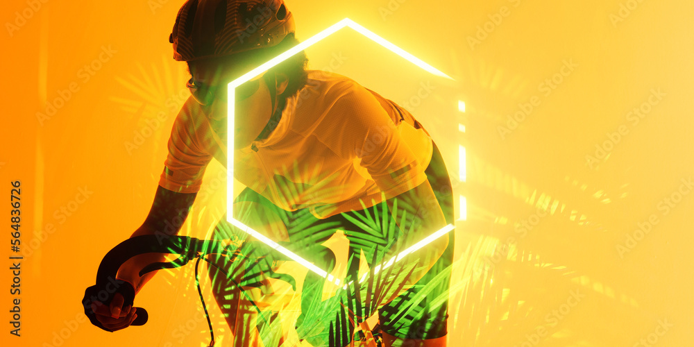 African american female athlete riding bike by illuminated hexagon and plants on yellow background