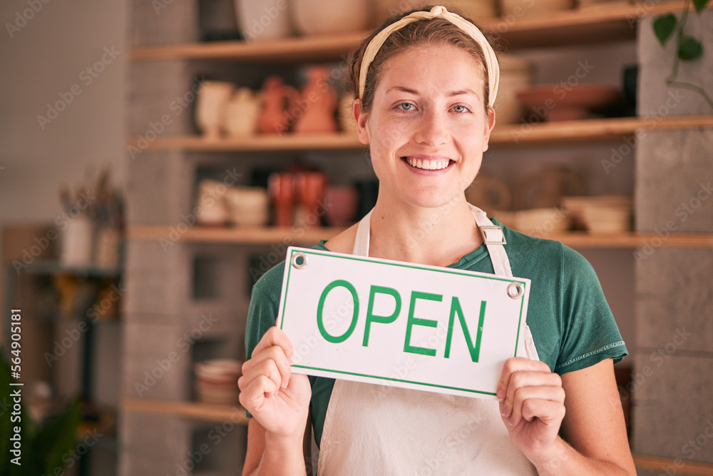 Woman, small business and open sign for creative startup, welcome or entrepreneurship at retail stor