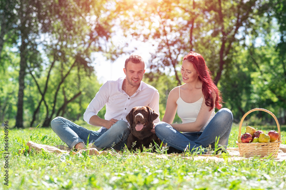 Couple with a dog in the park