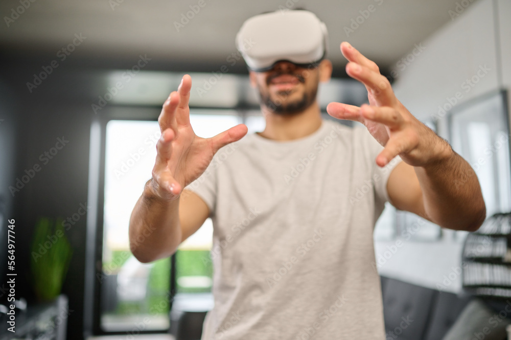 Virtual reality glasses, technology and hands of man in home with headset for interactive, online an