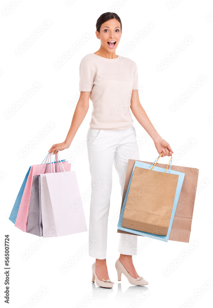 Full length shot of an attractive young woman looking excited while holding shopping bags isolated o