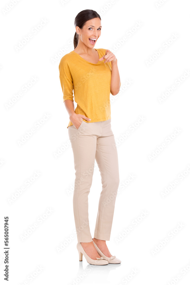 Full-length portrait of a young beautiful woman pointing at the camera isolated on a PNG background.