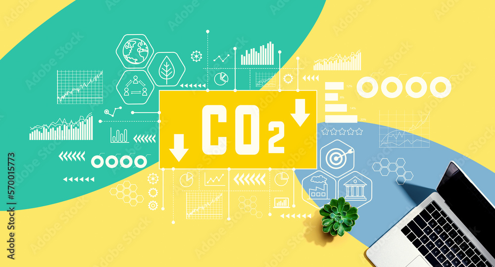 Reduce CO2 theme with a laptop computer on a yellow, green and blue pattern background