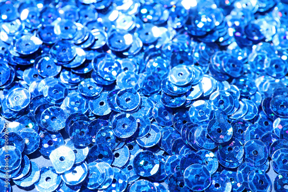 Blue sequins as background, closeup