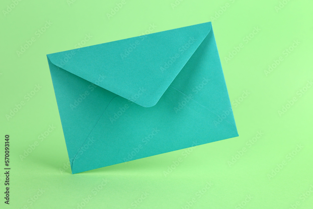 Paper envelope on green background