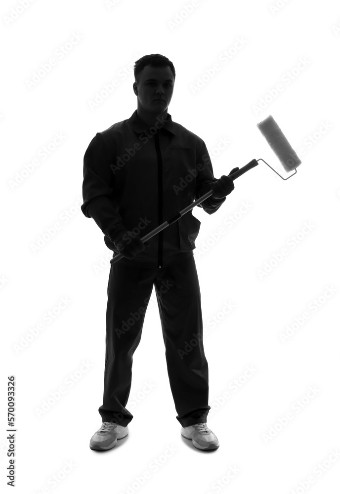 Silhouette of young decorator with paint roller on white background