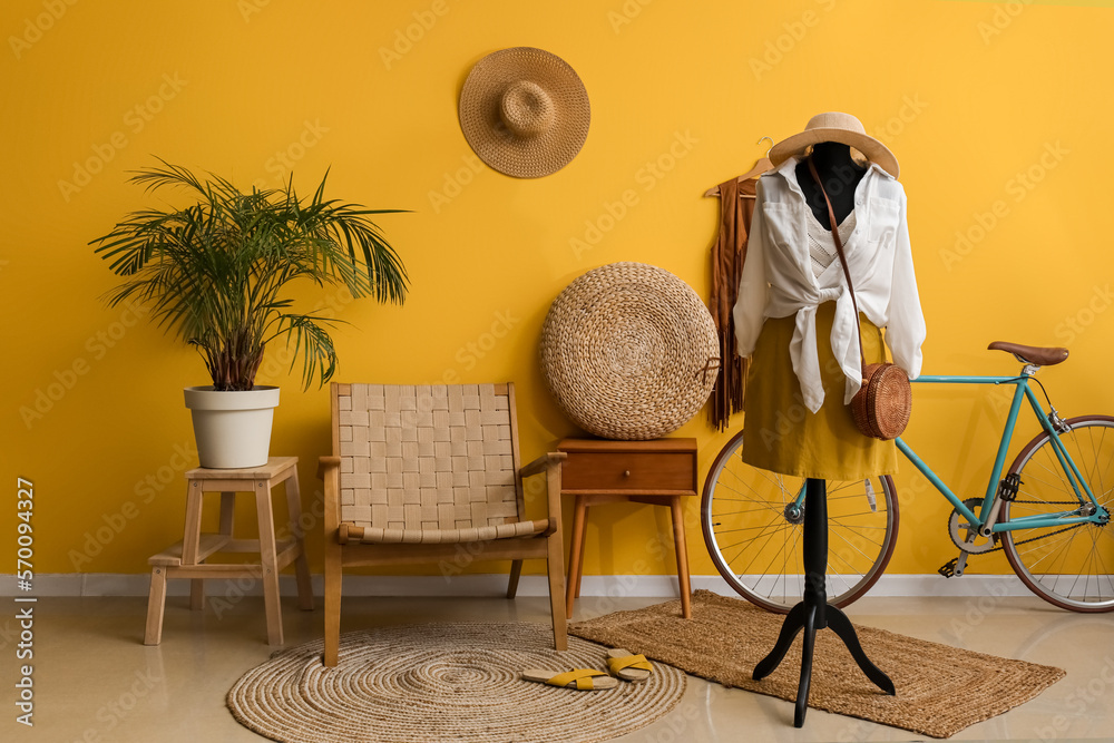 Interior of fashion designers studio with mannequin, clothes and bicycle