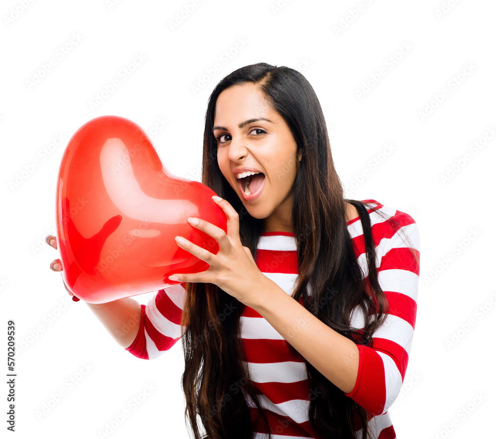 A super excited beautiful young woman shouting of joy and happiness posing by holding a heart shaped