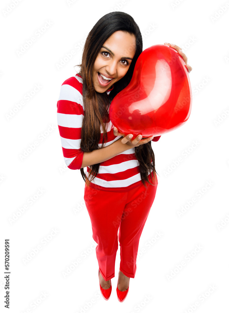 A cheerful young woman in a party wear holding a heart shaped balloon with an excitement for a party