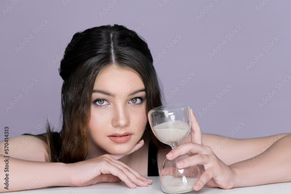 Concept of skincare and anti-aging beauty care with charming young plum girl closeup portrait holdin