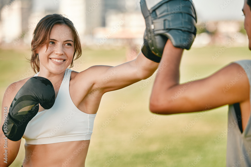 Boxing, woman and personal trainer exercise outdoor in nature park for fitness, health and wellness.