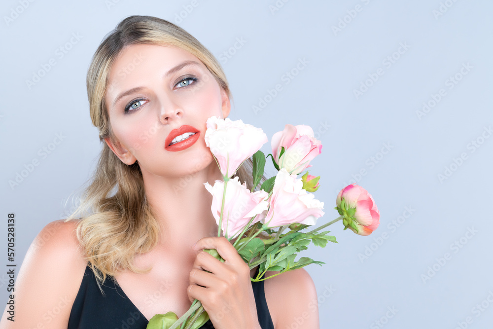 Closeup young woman with alluring flawless makeup and healthy soft skin holding rose for natural ski