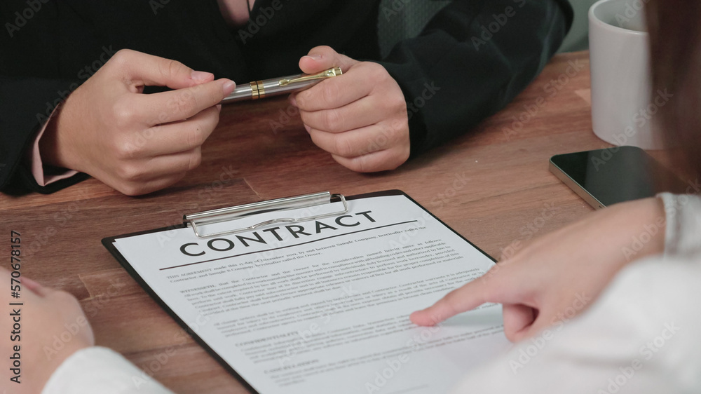 Closeup young enthusiastic businesswoman negotiate financial business contract in the office. Client