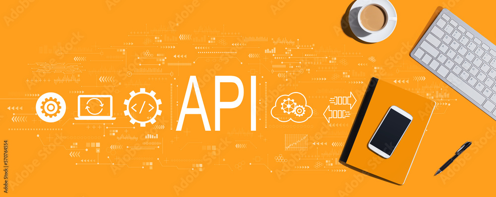 API - application programming interface concept with a computer keyboard and office items