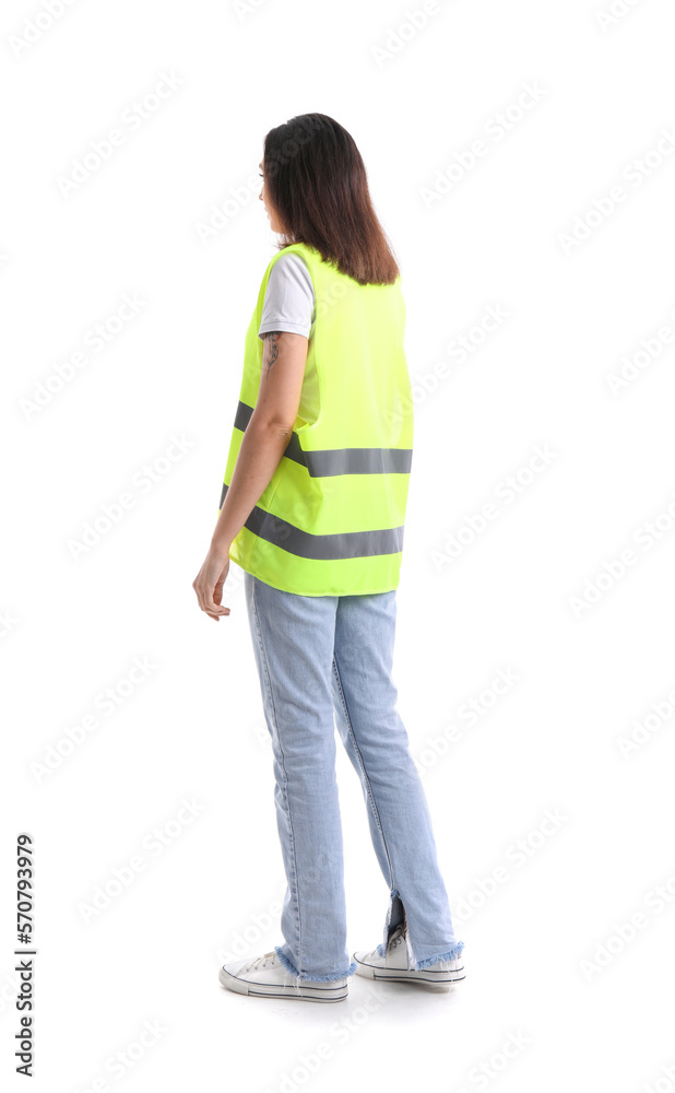 Female worker in vest on white background