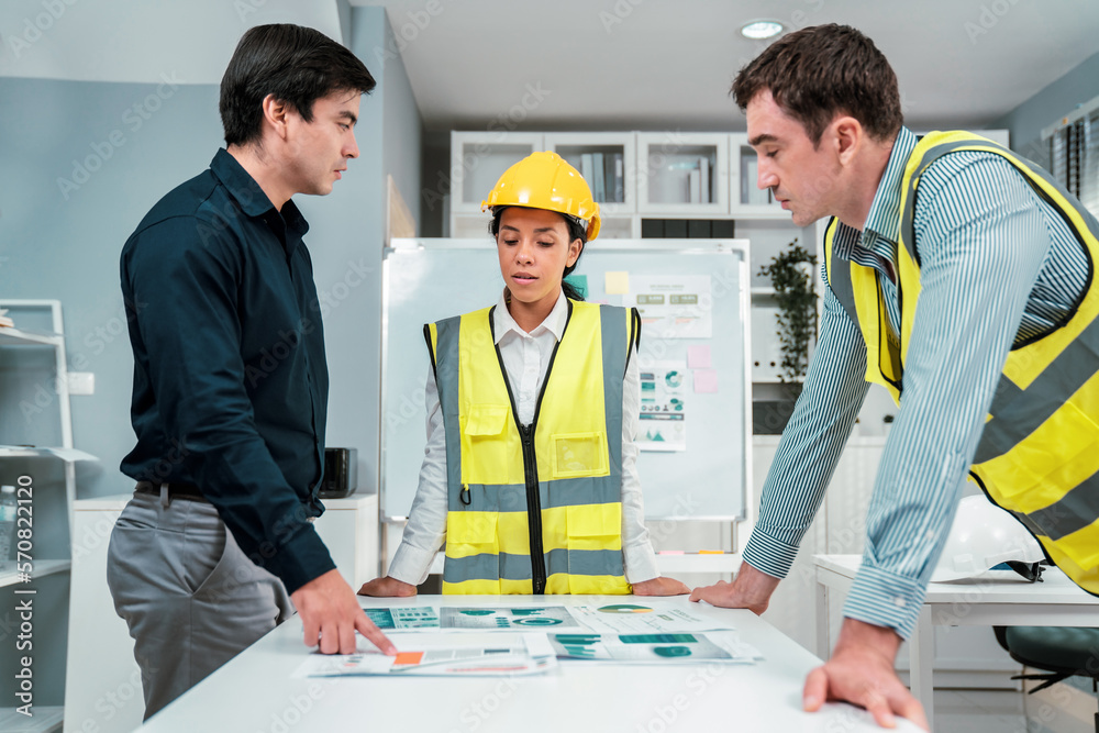 A group of competent engineers and employer discuss plans in the office. Architectural investor, bus