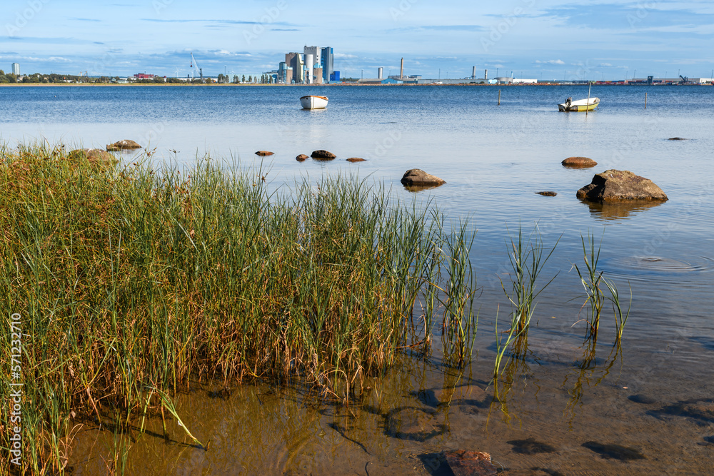 Halmstad coastline of Kattegat sea with industrial port in background.