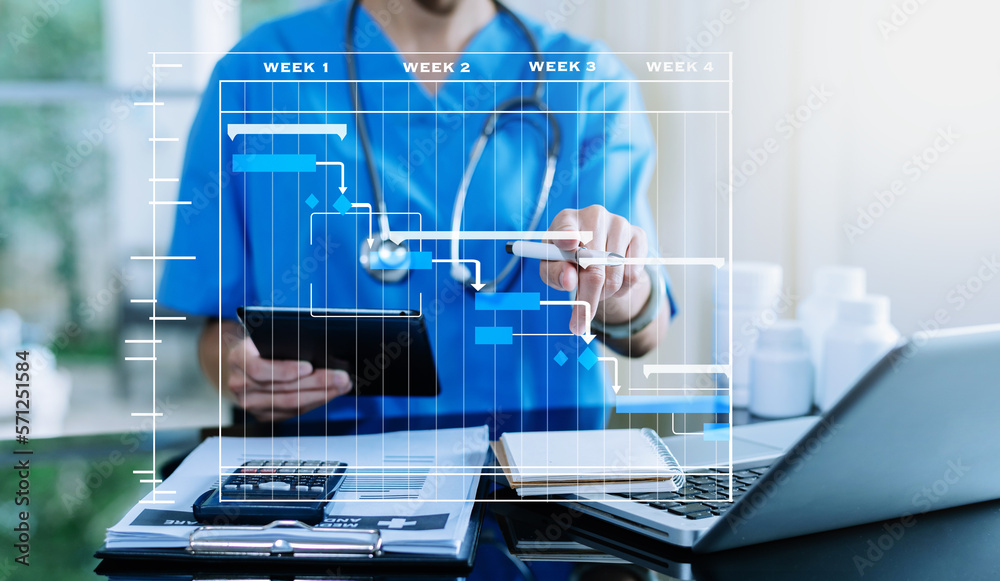 Project manager working and update tasks with Gantt chart scheduling diagram at hospital .success sm
