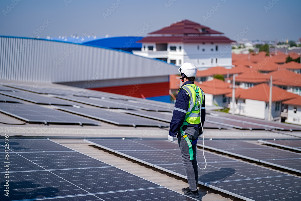 Technology solar cell, Engineer service check installation solar cell on the roof of factory. techni