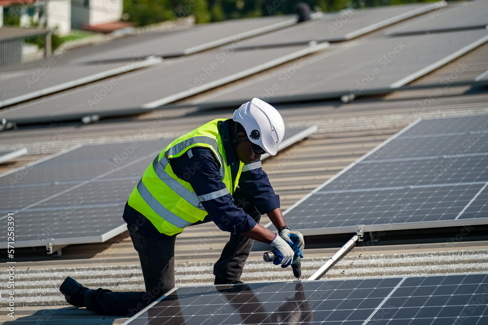 Technology solar cell, Engineer service check installation solar cell on the roof of factory. techni