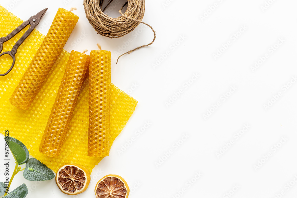 DIY concept. Handmade beeswax honey aroma candles with honeycombs