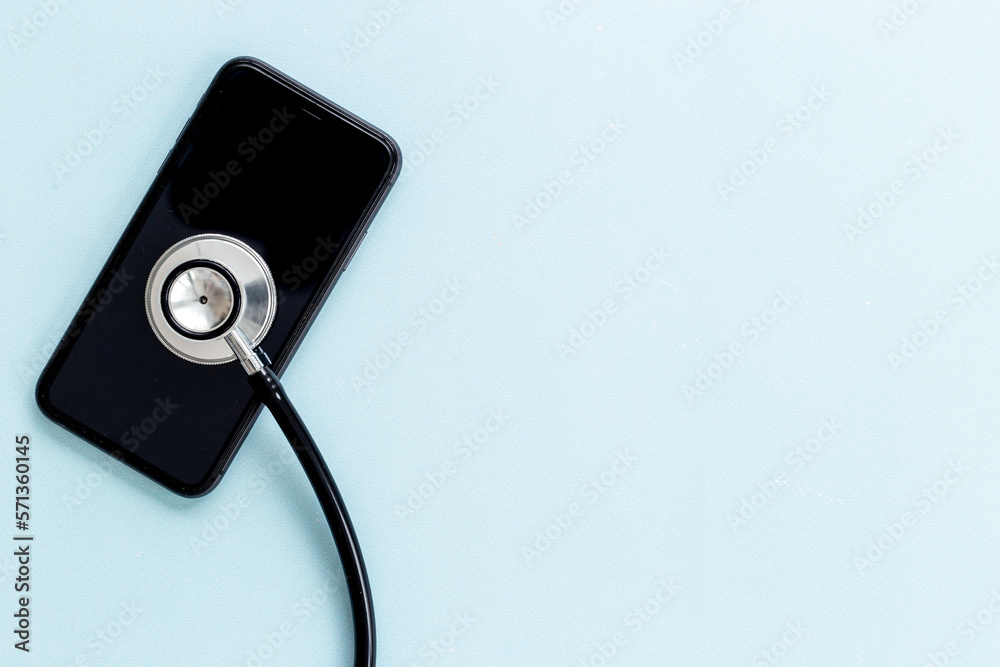 Electronics repair servise concept - mobile phone with stethoscope