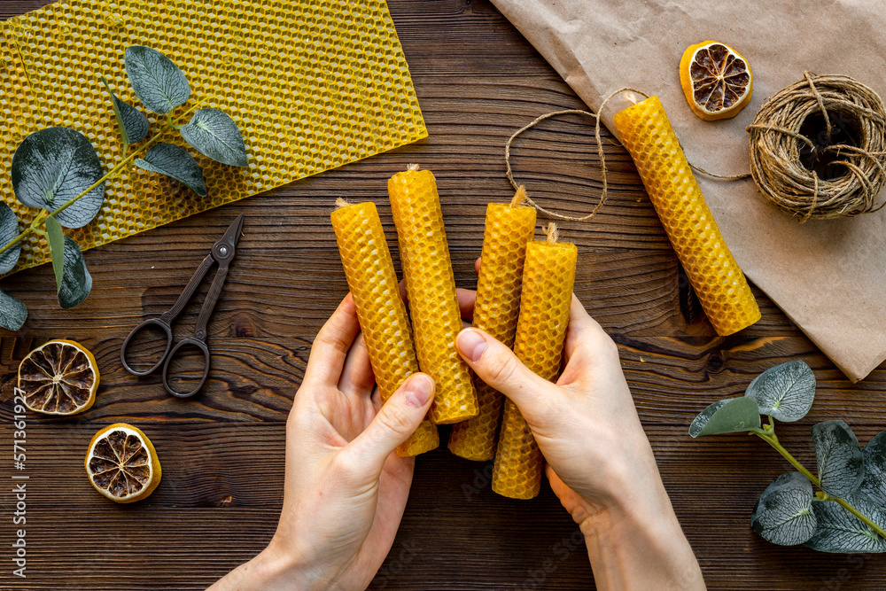 DIY - do it yourself concept. Hands making beeswax honey aroma candles