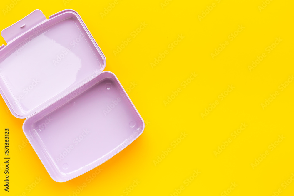 Empty plastic lunch box. Purple container for food, top view