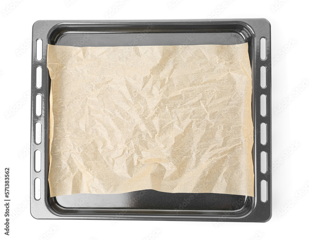 Baking sheet with paper isolated on white background