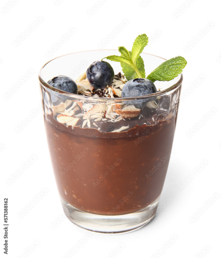 Glass of delicious chocolate pudding with blueberry, almond and mint isolated on white background